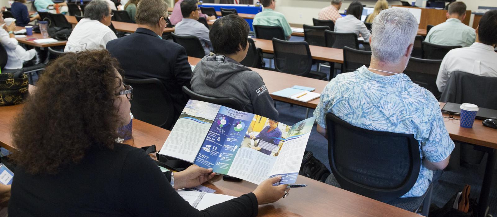 A group of people in a meeting room